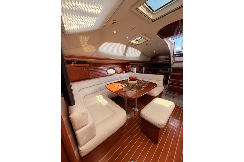 Slide: The Image of Luxurious interior of 2009 Hunter 50 Center Cockpit yacht with elegant seating and dining area. - 74