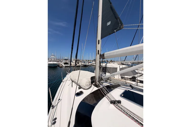 Slide: The Image of Sailboat Hunter 50 Center Cockpit 2009 docked in marina under clear blue sky. - 20