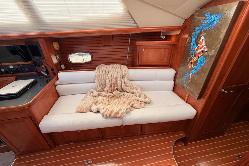 Slide: The Image of Luxurious 2009 Hunter 50 Center Cockpit interior with plush seating and vibrant artwork. - 61