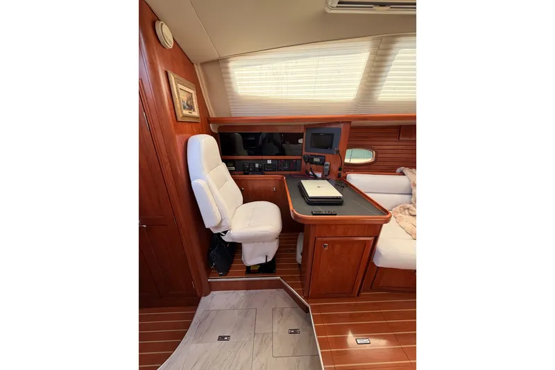 Slide: The Image of Luxurious interior of 2009 Hunter 50 Center Cockpit yacht with navigation station. - 42
