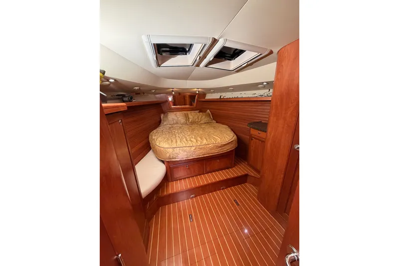 Slide: The Image of Luxurious 2009 Hunter 50 Center Cockpit yacht interior with wood finish and cozy bed. - 66