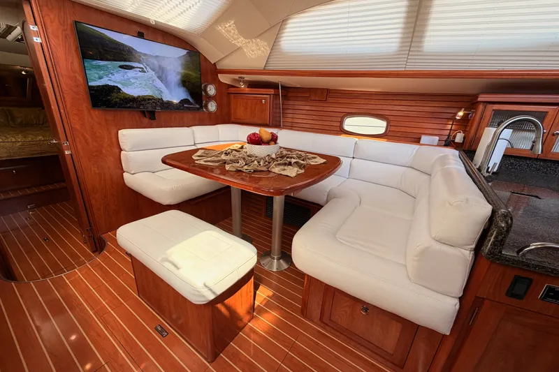Slide: The Image of Luxurious 2009 Hunter 50 Center Cockpit interior with elegant seating and wooden finishes. - 59