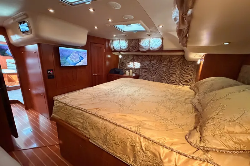 Slide: The Image of Luxurious cabin interior of 2009 Hunter 50 Center Cockpit yacht with elegant bedding. - 90