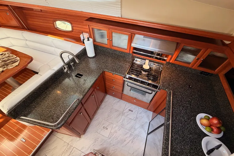 Slide: The Image of Luxurious 2009 Hunter 50 Center Cockpit yacht interior with modern kitchen and dining area. - 40
