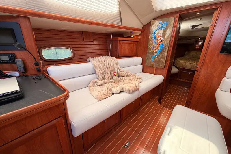 Slide: The Image of Luxurious 2009 Hunter 50 Center Cockpit interior with plush seating and elegant wood finishes. - 58