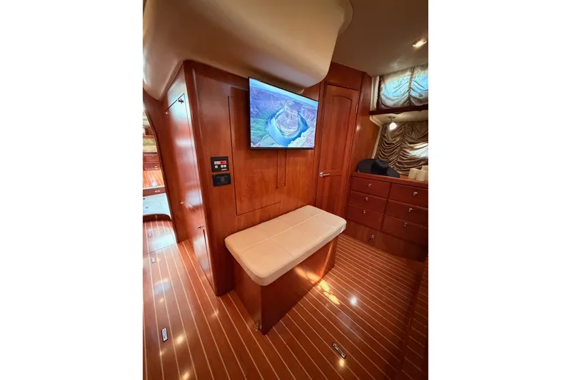 Slide: The Image of Luxurious interior of 2009 Hunter 50 Center Cockpit yacht with wood finish and TV. - 91