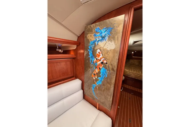 Slide: The Image of Interior of 2009 Hunter 50 Center Cockpit with vibrant abstract artwork. - 63