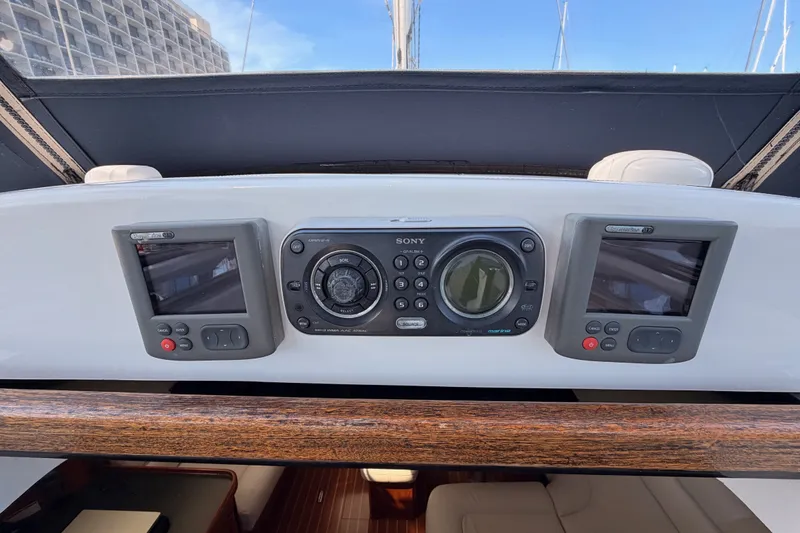 Slide: The Image of Control panel of a 2009 Hunter 50 Center Cockpit sailboat with navigation displays. - 38