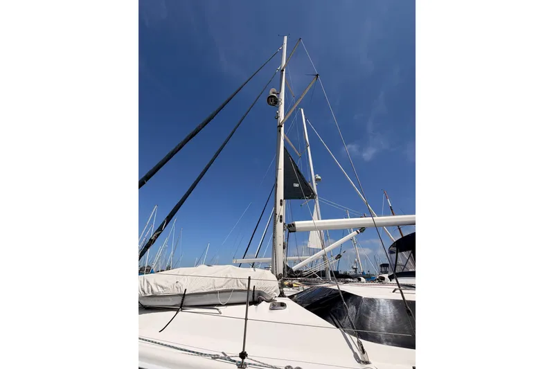 Slide: The Image of Hunter 50 Center Cockpit sailboat, 2009 model, with mast and rigging against clear blue sky. - 7