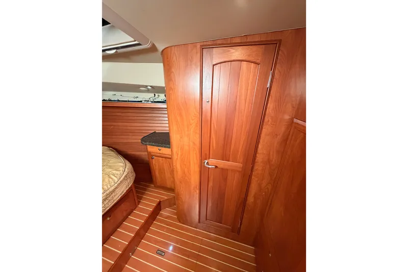 Slide: The Image of Interior of 2009 Hunter 50 Center Cockpit with wooden door and flooring. - 70