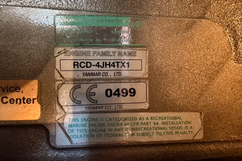 Slide: The Image of Engine label on 2009 Hunter 50 Center Cockpit, Yanmar RCD-4JH4TX1, CE certified. - 103