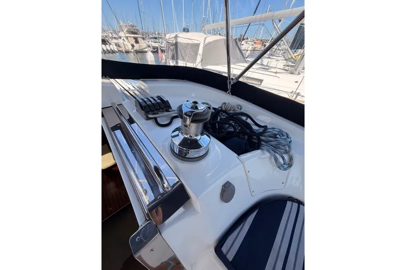 Slide: The Image of 2009 Hunter 50 Center Cockpit sailboat deck with winch and ropes in marina. - 36