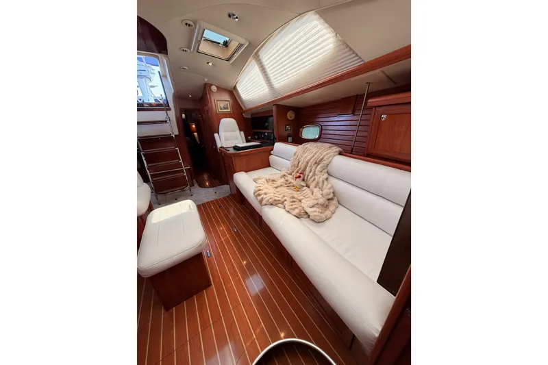 Slide: The Image of Luxurious interior of 2009 Hunter 50 Center Cockpit yacht with plush seating and wood finishes. - 73