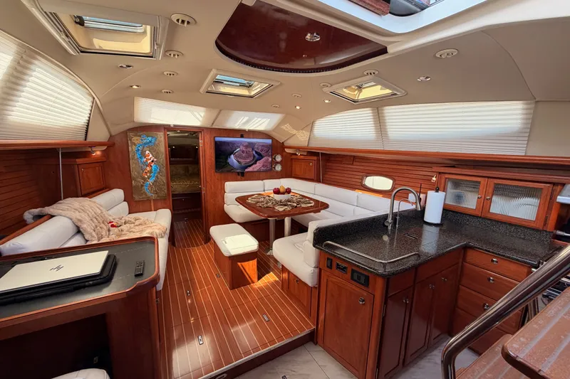 Slide: The Image of Luxurious 2009 Hunter 50 Center Cockpit interior with elegant wood finish and modern amenities. - 99