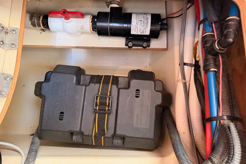 Slide: The Image of Electrical and plumbing components inside a 2009 Hunter 50 Center Cockpit sailboat. - 112