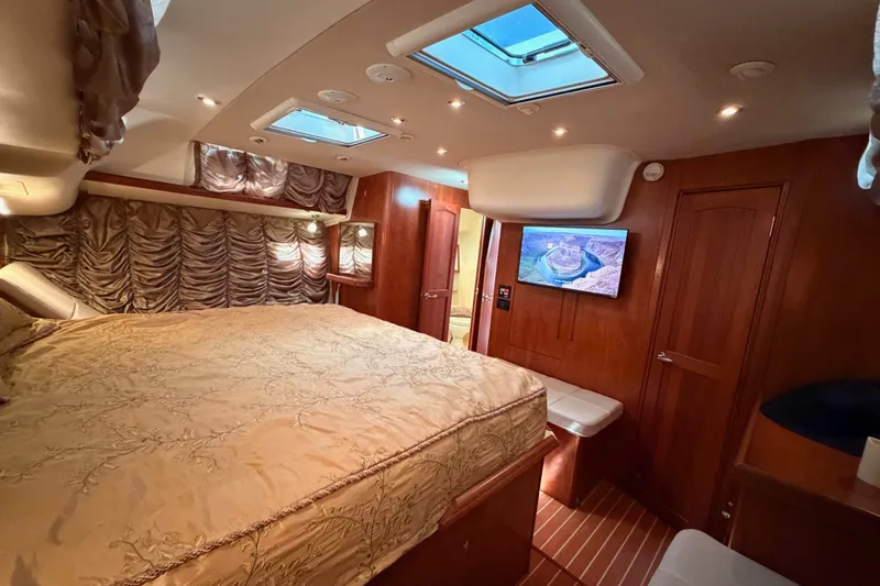 Slide: The Image of Luxurious interior of 2009 Hunter 50 Center Cockpit yacht with elegant bedding and wood finishes. - 96