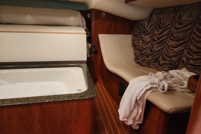Slide: The Image of Luxurious interior of 2009 Hunter 50 Center Cockpit yacht with bathtub and seating area. - 87
