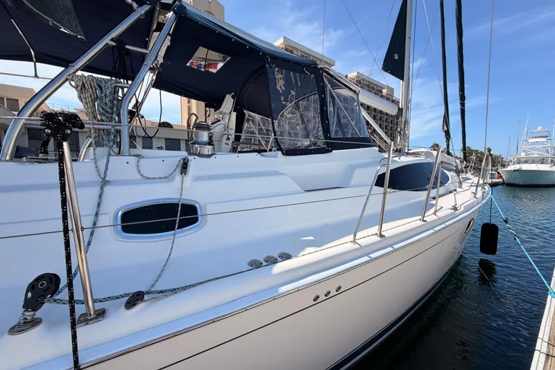 Slide: The Image of 2009 Hunter 50 Center Cockpit sailboat docked at marina, featuring sleek design and modern amenities. - 11