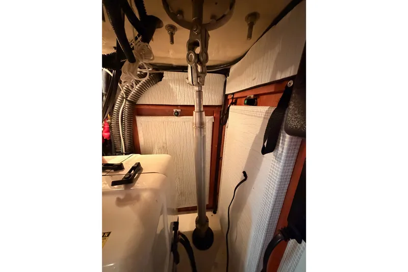 Slide: The Image of Engine room of 2009 Hunter 50 Center Cockpit sailboat, showing mechanical components and wiring. - 106