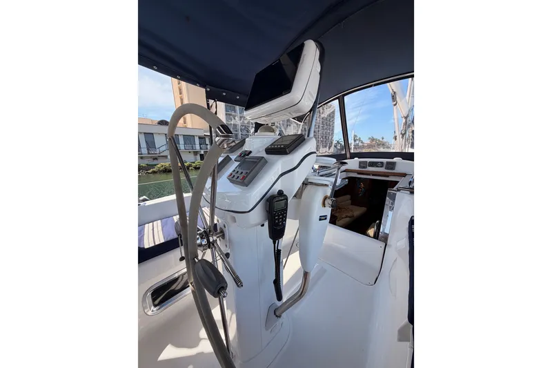 Slide: The Image of Cockpit of 2009 Hunter 50 Center Cockpit sailboat with navigation equipment and steering wheel. - 33