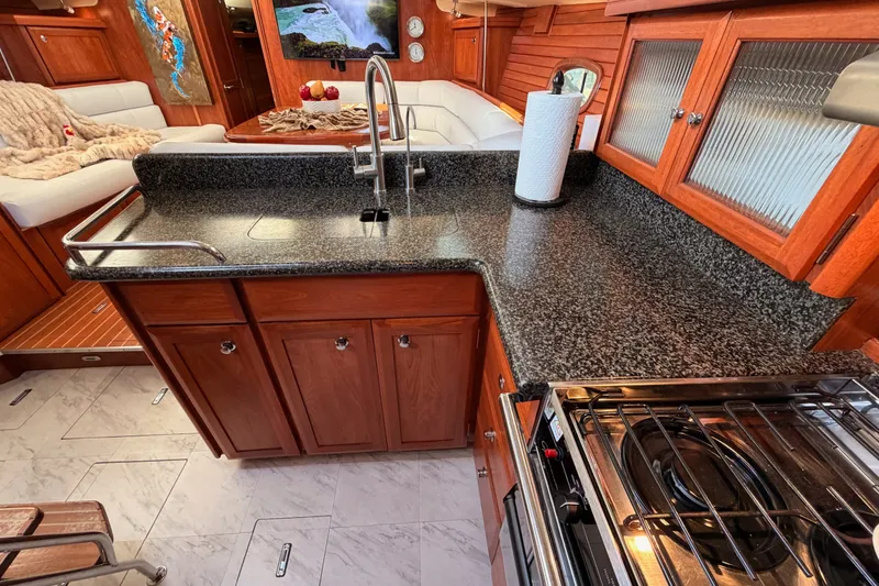 Slide: The Image of Luxurious 2009 Hunter 50 Center Cockpit interior with modern kitchen and cozy seating area. - 56