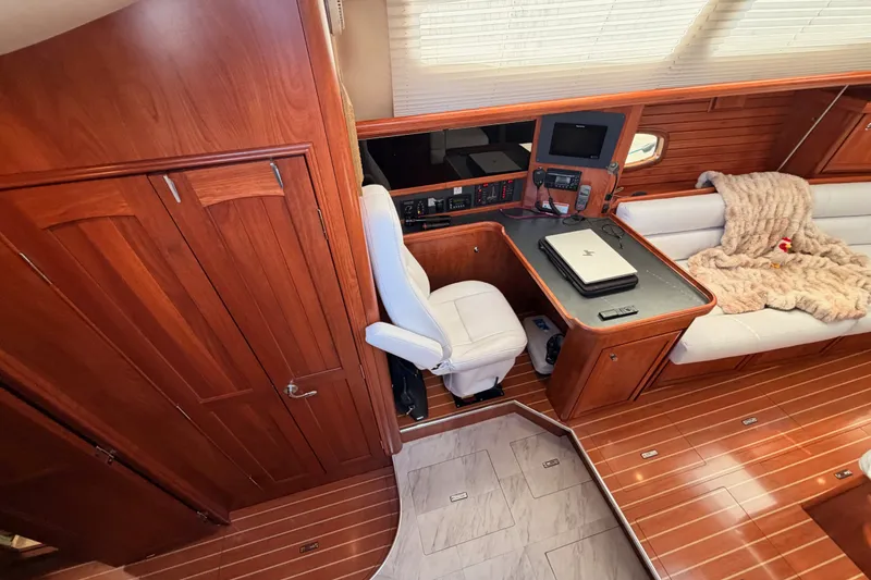 Slide: The Image of Luxurious interior of 2009 Hunter 50 Center Cockpit with wood finish and navigation station. - 41