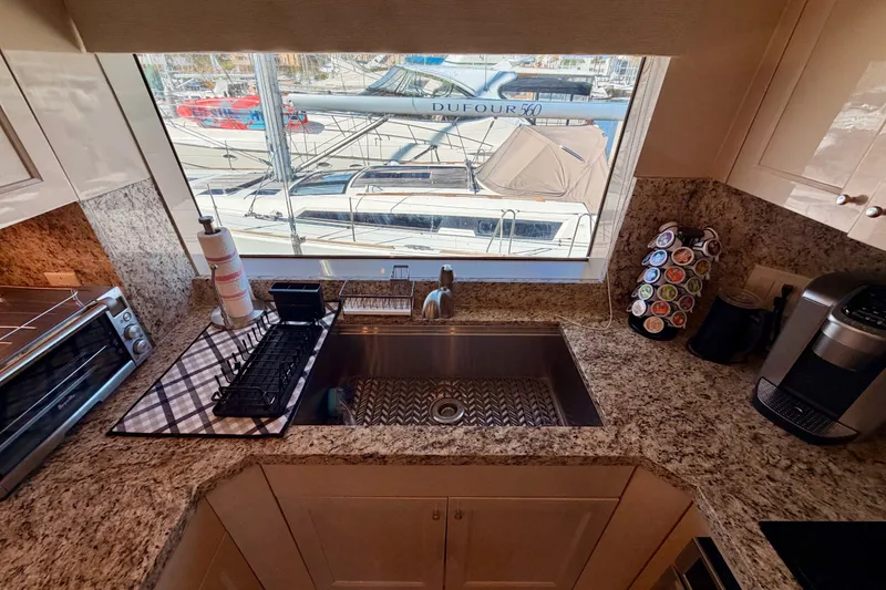 Slide: The Image of Kitchen interior of 1996 Hatteras 70 Sport Deck Motor Yacht with granite countertops. - 46