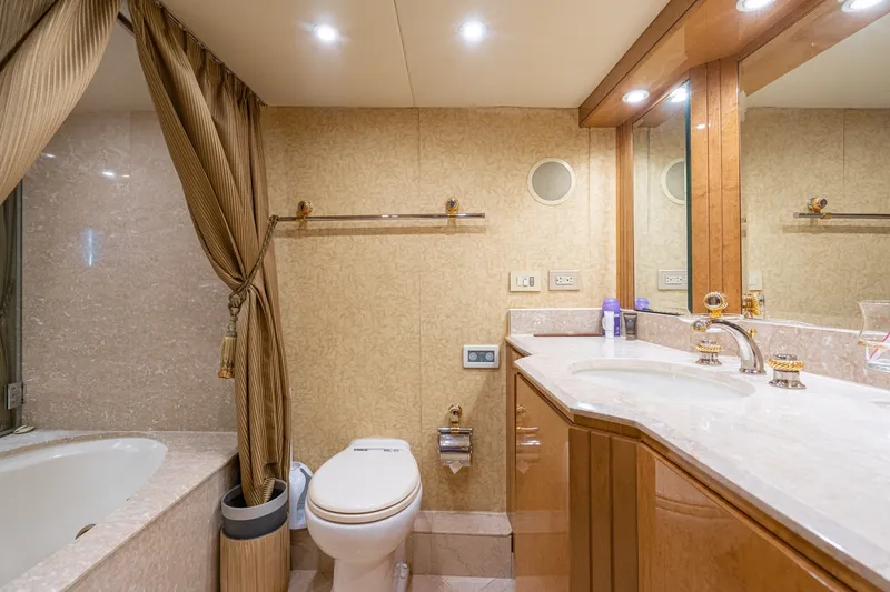 Slide: The Image of Luxurious bathroom in 1996 Hatteras 70 Sport Deck Motor Yacht with marble accents. - 55
