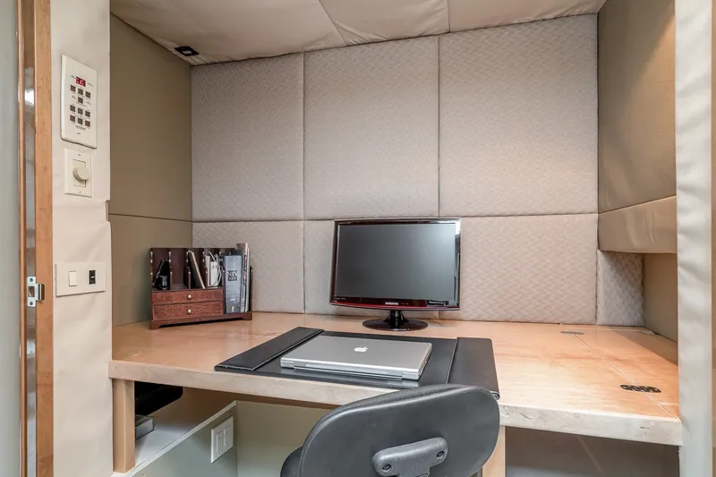 Slide: The Image of Compact office space on 1996 Hatteras 70 Sport Deck Motor Yacht with desk and monitor. - 64