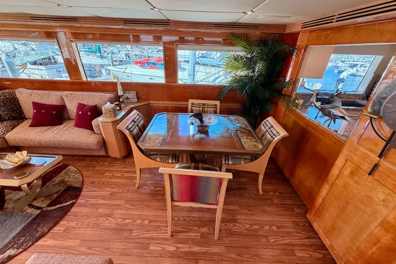 Slide: The Image of Luxurious interior of 1996 Hatteras 70 Sport Deck Motor Yacht with elegant dining area. - 37
