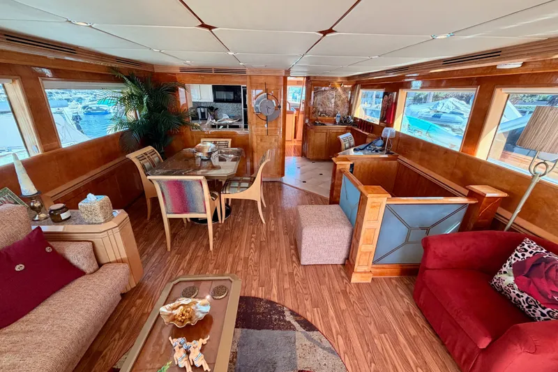 Slide: The Image of Luxurious interior of a 1996 Hatteras 70 Sport Deck Motor Yacht with elegant wood finishes. - 36