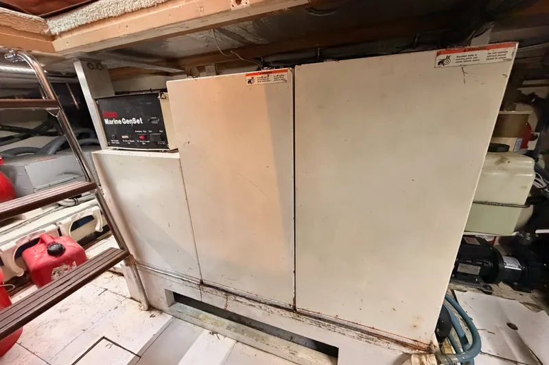 Slide: The Image of Engine room of 1996 Hatteras 70 Sport Deck Motor Yacht with marine generator. - 98