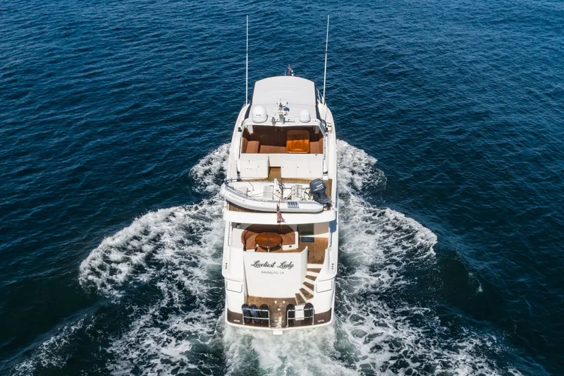 Slide: The Image of Aerial view of 1996 Hatteras 70 Sport Deck Motor Yacht cruising on open water. - 3