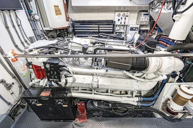 Slide: The Image of Engine room of a 1996 Hatteras 70 Sport Deck Motor Yacht, featuring Detroit Diesel engine. - 71