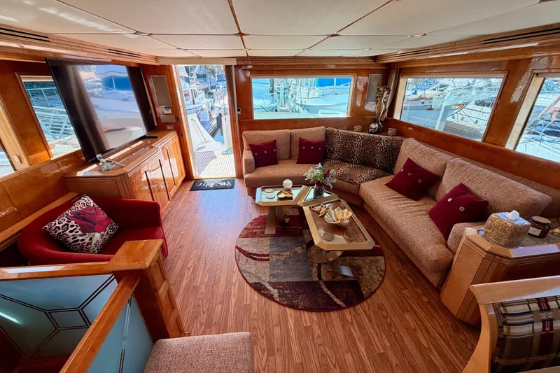 Slide: The Image of Luxurious interior of 1996 Hatteras 70 Sport Deck Motor Yacht with elegant seating and decor. - 40