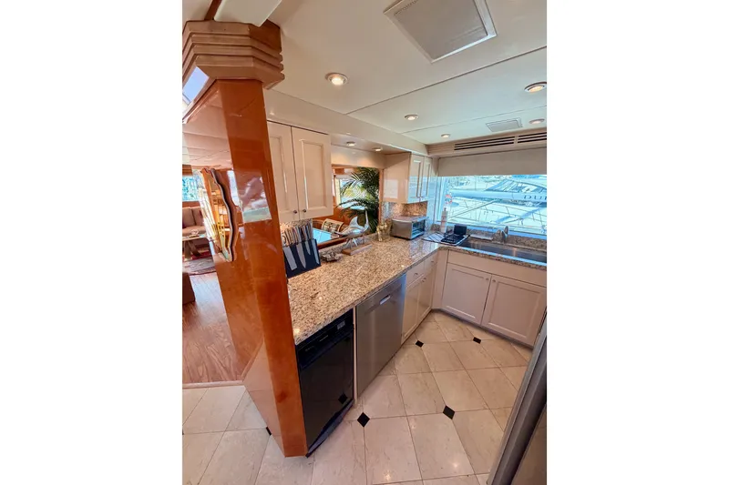 Slide: The Image of Luxurious kitchen interior of 1996 Hatteras 70 Sport Deck Motor Yacht. - 42