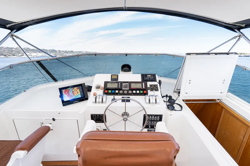 Slide: The Image of Helm of 1996 Hatteras 70 Sport Deck Motor Yacht with navigation equipment. - 21