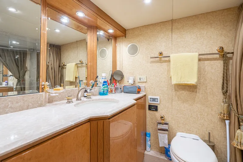 Slide: The Image of Luxurious bathroom in 1996 Hatteras 70 Sport Deck Motor Yacht with elegant fixtures and decor. - 59