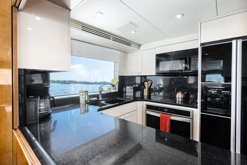Slide: The Image of Modern kitchen interior on 1996 Hatteras 70 Sport Deck Motor Yacht with ocean view. - 43