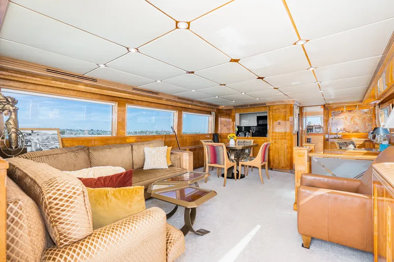 Slide: The Image of Luxurious interior of a 1996 Hatteras 70 Sport Deck Motor Yacht with elegant furnishings. - 37