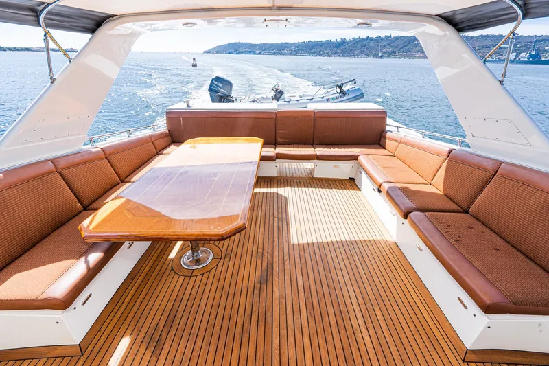 Slide: The Image of Luxurious seating area on 1996 Hatteras 70 Sport Deck Motor Yacht, featuring elegant wood finishes. - 20