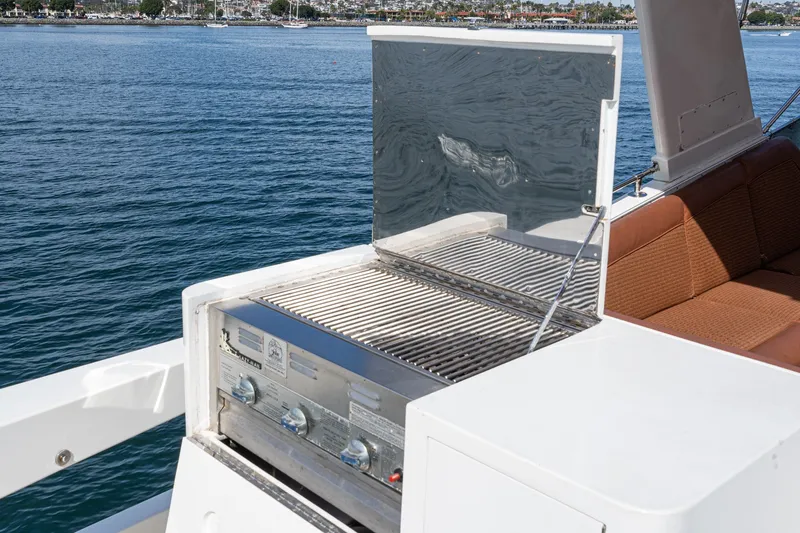 Slide: The Image of Outdoor grill on 1996 Hatteras 70 Sport Deck Motor Yacht with ocean view. - 15
