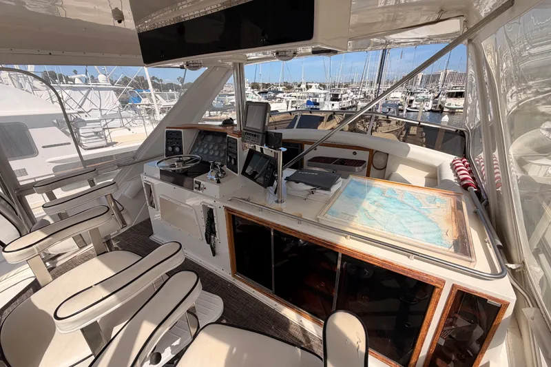 Slide: The Image of Interior of a 1982 Bertram 54 Convertible yacht with navigation equipment and seating. - 33