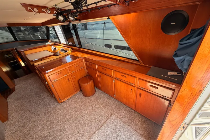 Slide: The Image of Interior of 1982 Bertram 54 Convertible yacht with wooden cabinetry and carpeted flooring. - 48