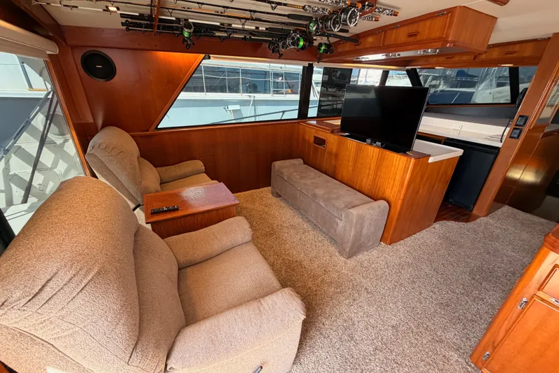 Slide: The Image of Luxurious interior of a 1982 Bertram 54 Convertible yacht with plush seating and modern amenities. - 52