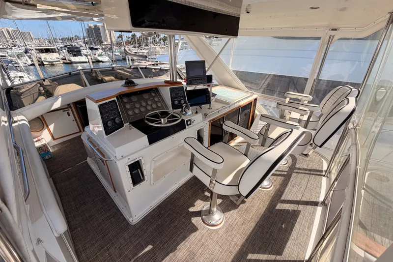 Slide: The Image of Interior of a 1982 Bertram 54 Convertible yacht with helm and seating area. - 27