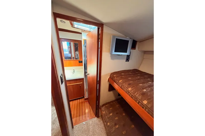 Slide: The Image of Interior of 1982 Bertram 54 Convertible yacht with bunk beds and bathroom. - 65