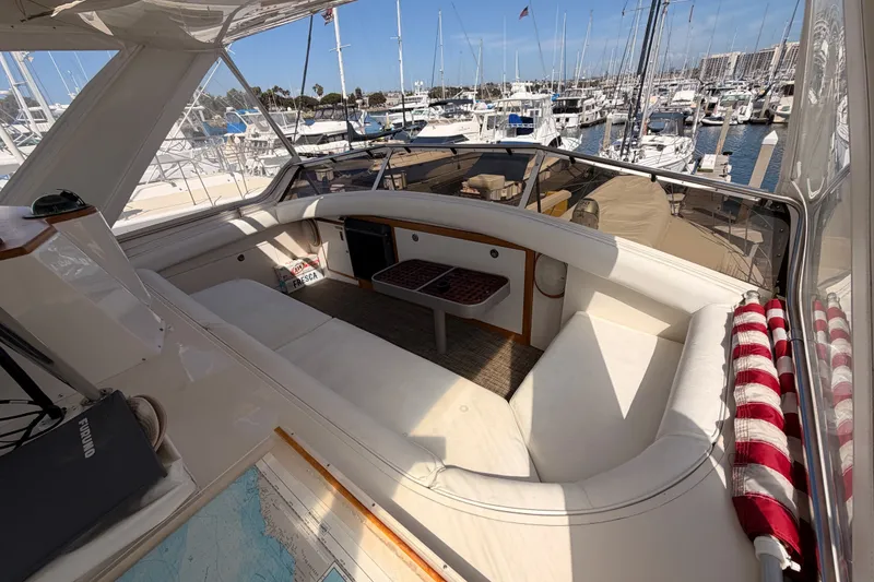Slide: The Image of Interior of a 1982 Bertram 54 Convertible yacht with marina view. - 34
