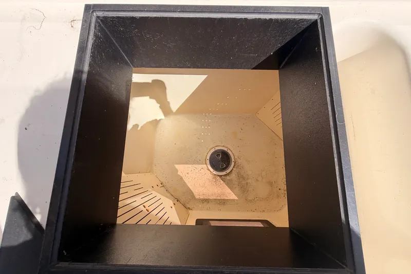 Slide: The Image of Open compartment on a 1982 Bertram 54 Convertible boat, showing interior details. - 40