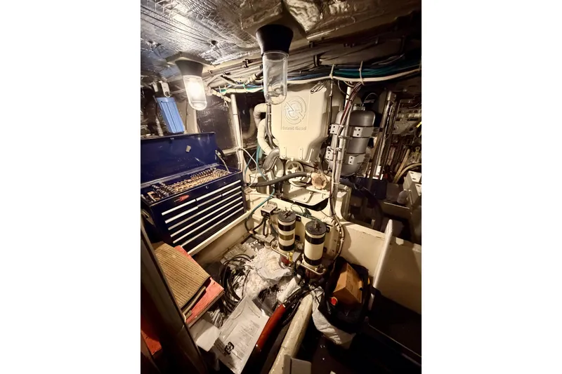 Slide: The Image of Engine room of a 1982 Bertram 54 Convertible with tools and equipment. - 88